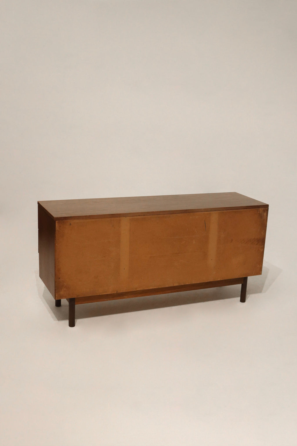 Close-up of the walnut wood grain showing the beautiful texture and veneer finish on the dresser top