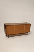 Close-up of the walnut wood grain showing the beautiful texture and veneer finish on the dresser top