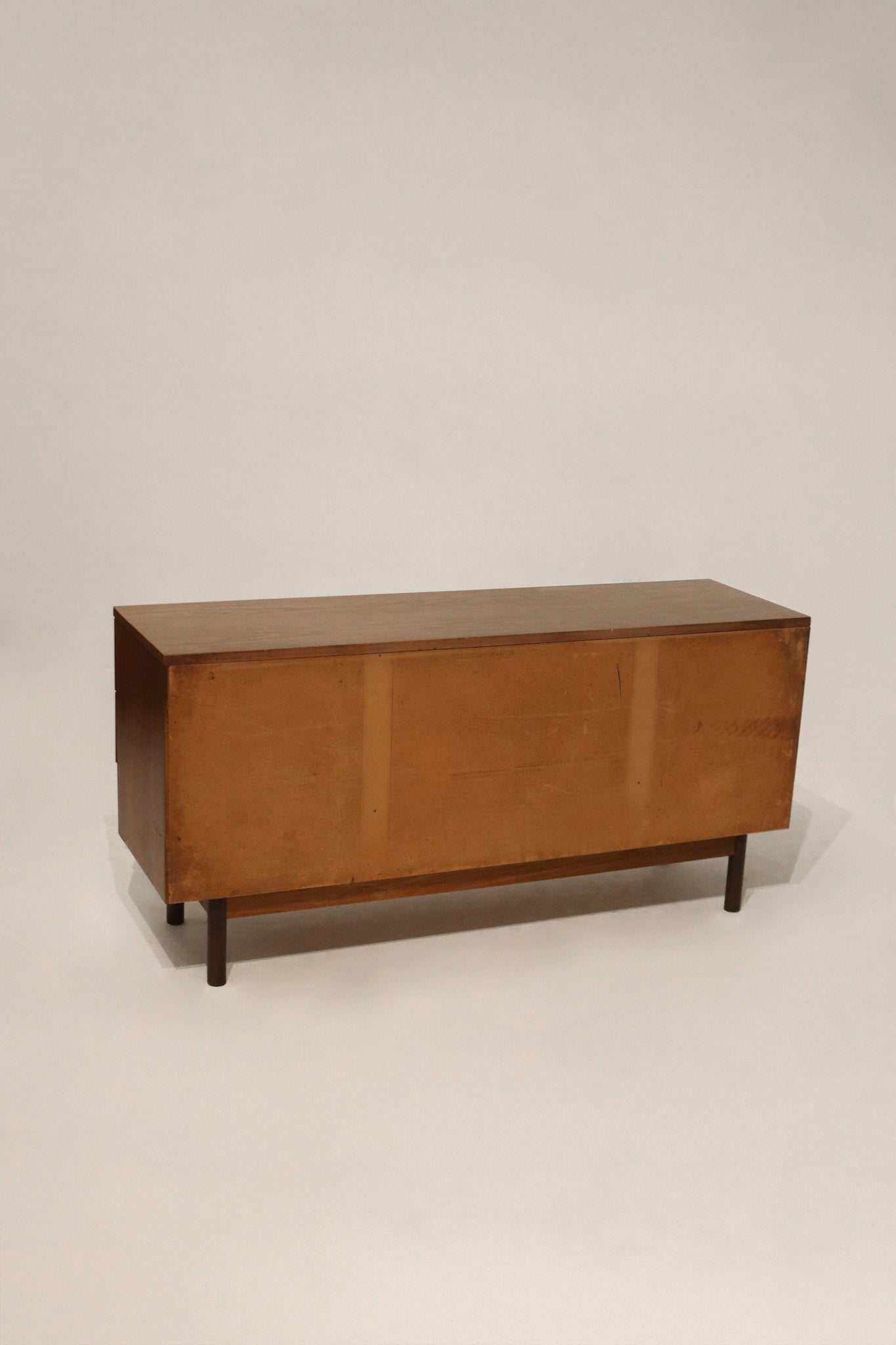 Close-up of the walnut wood grain showing the beautiful texture and veneer finish on the dresser top