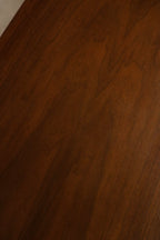 Detail of drawer fronts showing walnut grain continuity, original hardware and precise solid wood joinery
