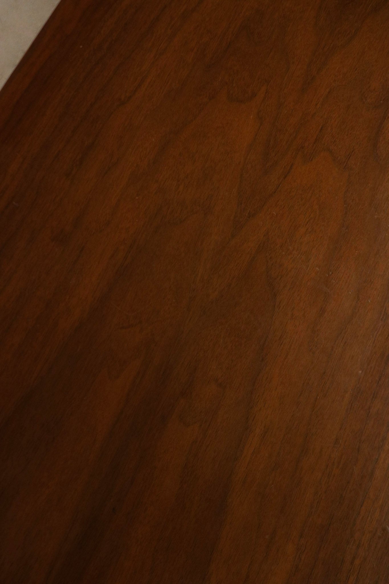 Detail of drawer fronts showing walnut grain continuity, original hardware and precise solid wood joinery