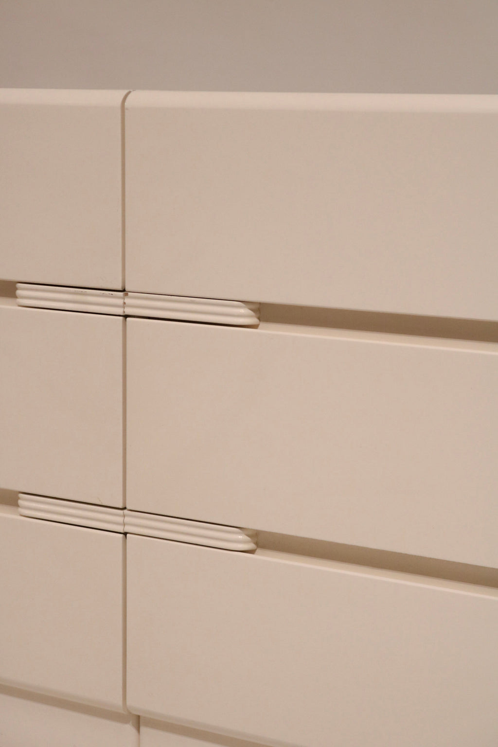 Bottom detail of the dresser unit showing base and postmodern block feet