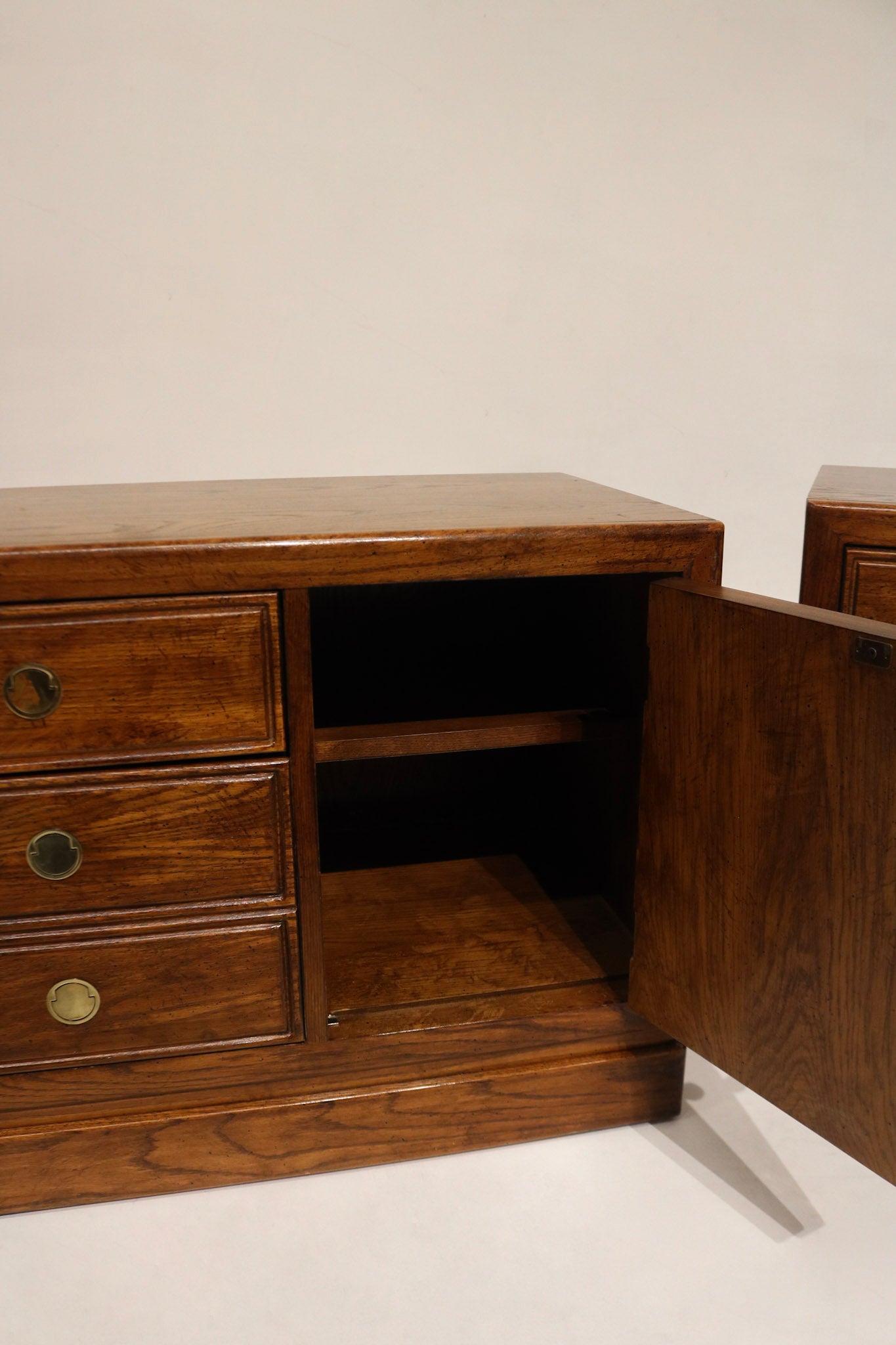 Back view of the Walnut Thomasville nightstands showing clean finish, solid wood back panels and no visible wear — well-preserved for NYC homes.