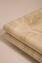 Angle perspective featuring the depth and geometry of the 42” x 42” lacquered coffee table