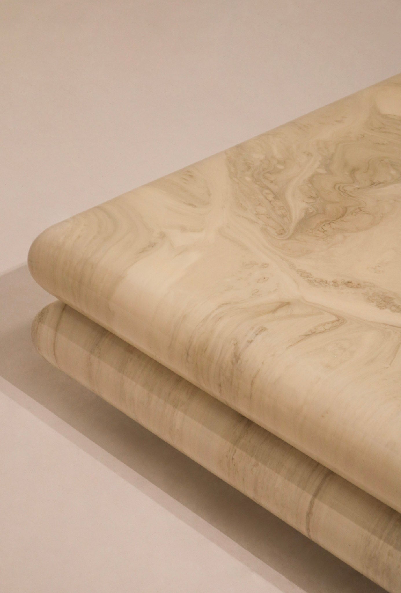 Angle perspective featuring the depth and geometry of the 42” x 42” lacquered coffee table