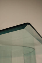 Detail shot of Vintage Square Glass Coffee Table highlighting one of the split base components in glass and metal
