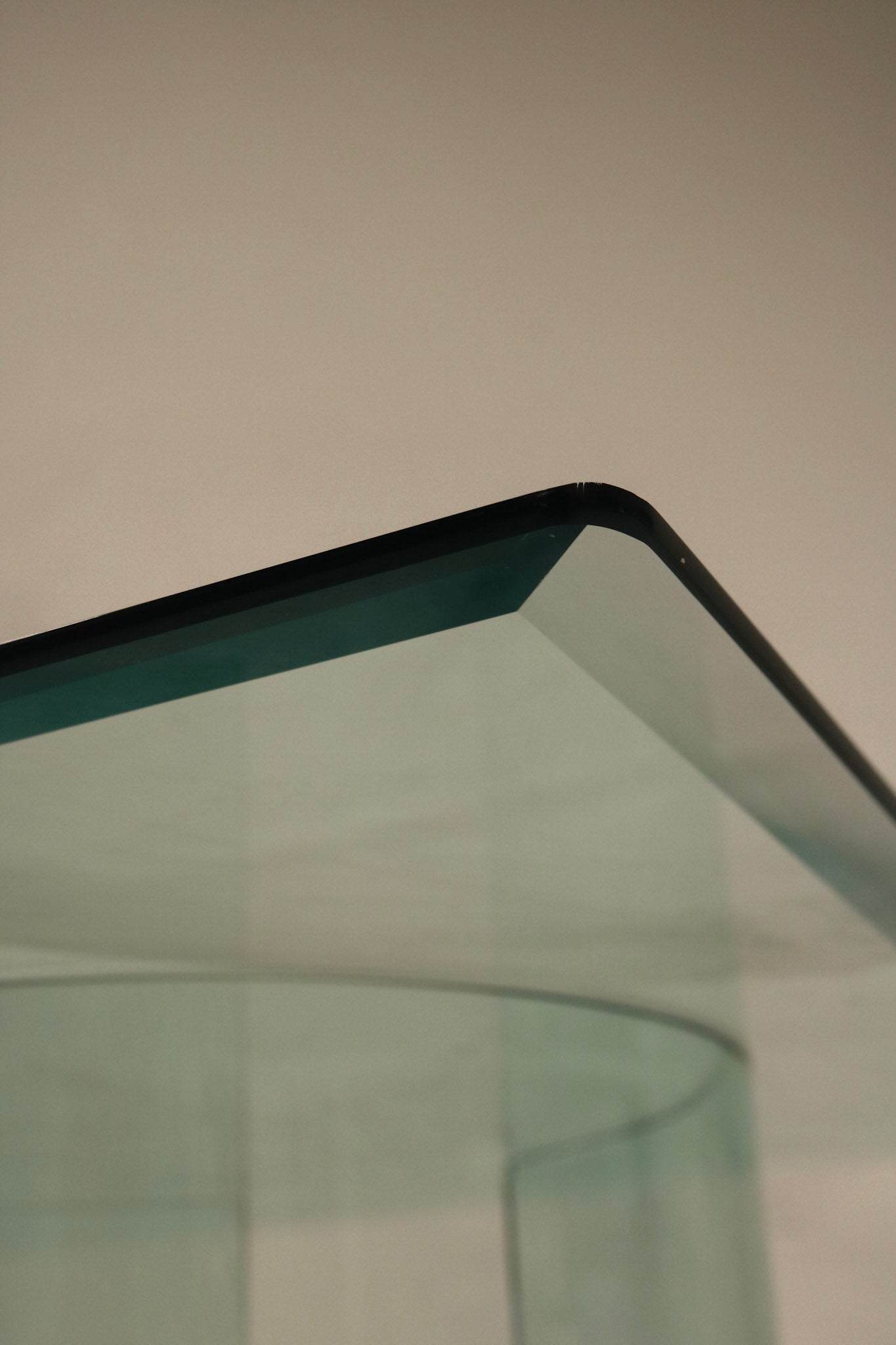Detail shot of Vintage Square Glass Coffee Table highlighting one of the split base components in glass and metal