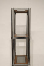 Detail of wood shelf showing rich grain and smooth surface on Vintage Chrome Glass Wood Bookcase