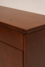 Close-up of wood grain texture on top surface showing minor wear marks in hardwood