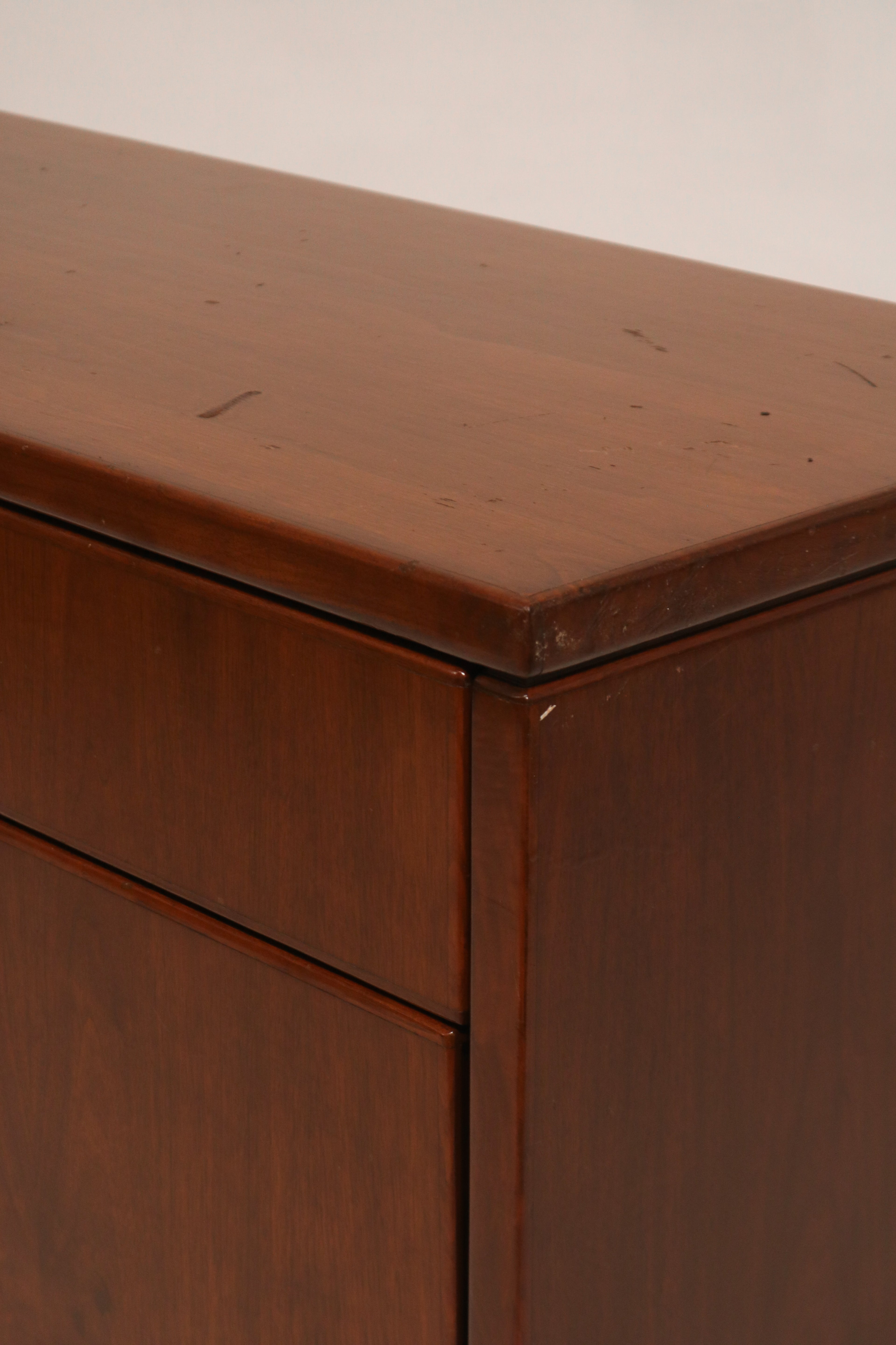 Close-up of wood grain texture on top surface showing minor wear marks in hardwood