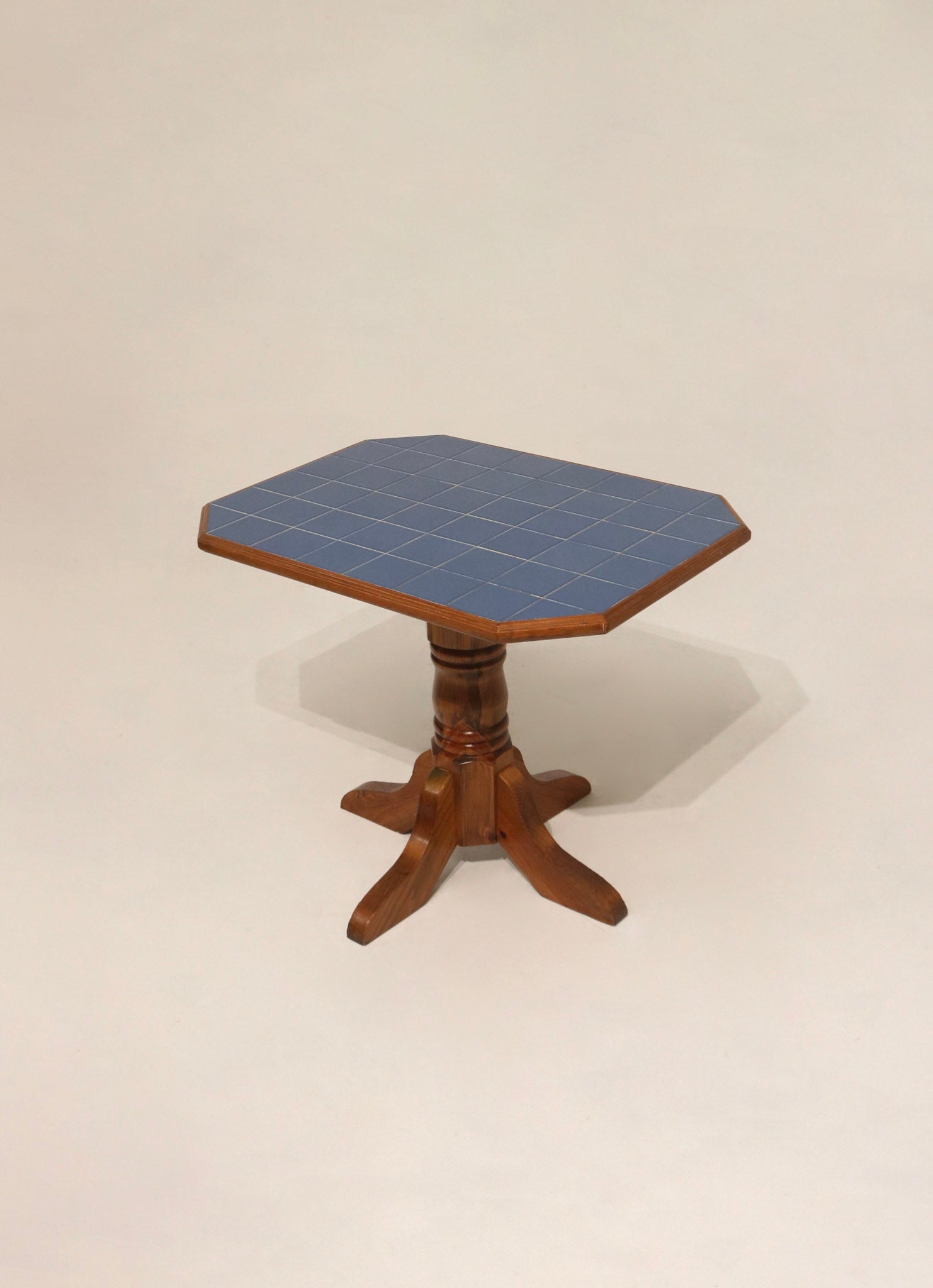 Solid oak wood pedestal base with ceramic tile top