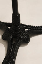 Close-up of tabletop edge on Vintage Stone Iron Metal Round Bistro Table with visible stone craftsmanship