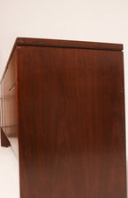 Side angle view highlighting clean lines and mid-century modern silhouette in oak wood
