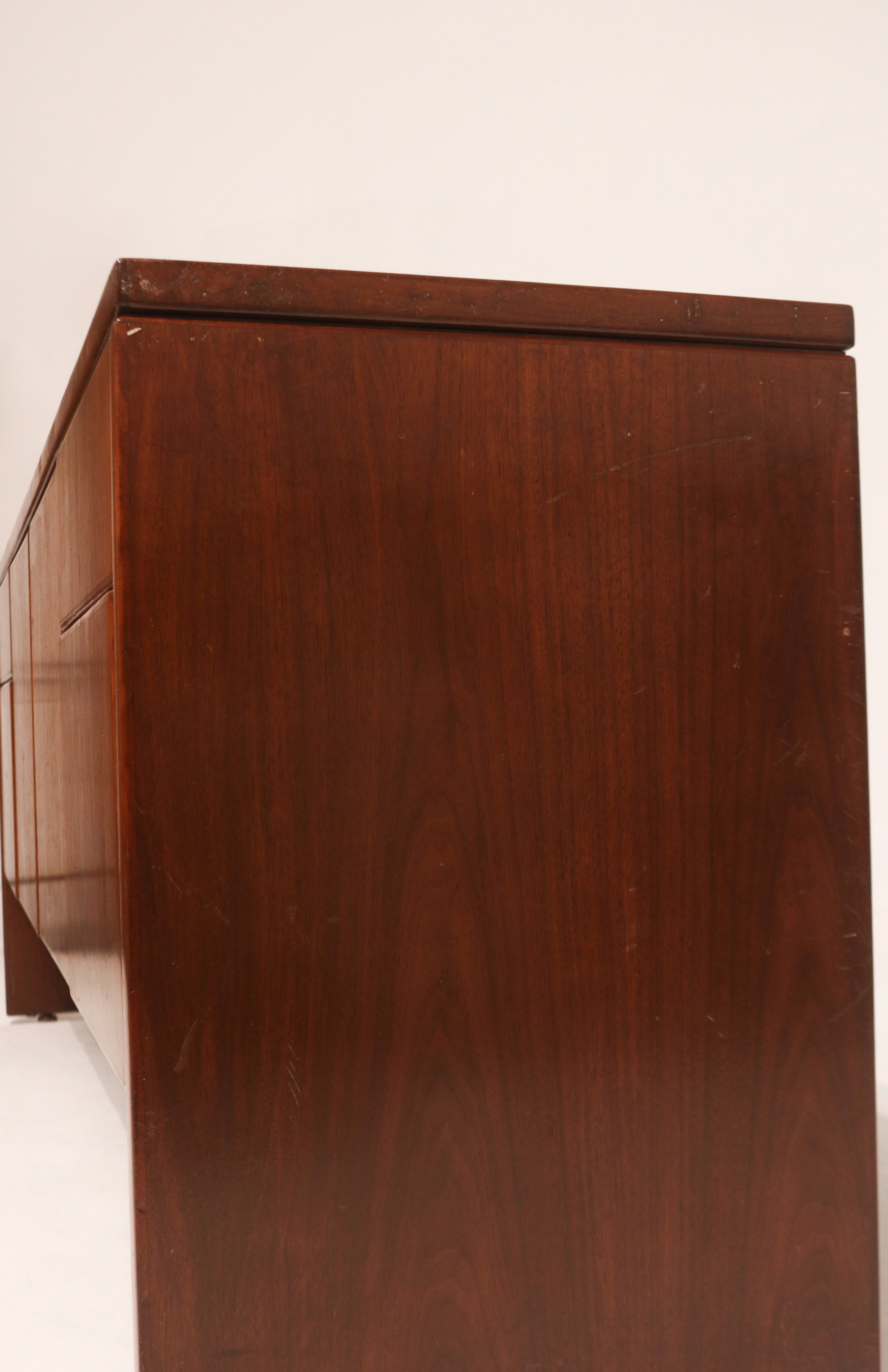 Side angle view highlighting clean lines and mid-century modern silhouette in oak wood