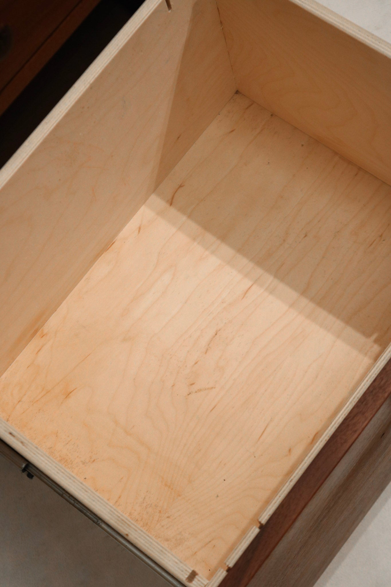 Close shot of subtle imperfections on top surface of walnut wood