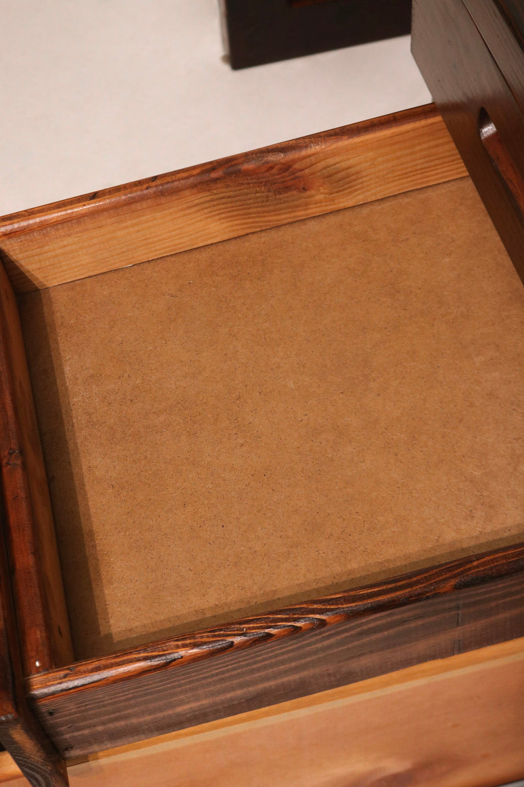 Close-up of unidentifiable label on the desk, aged but still visible for authenticity reference