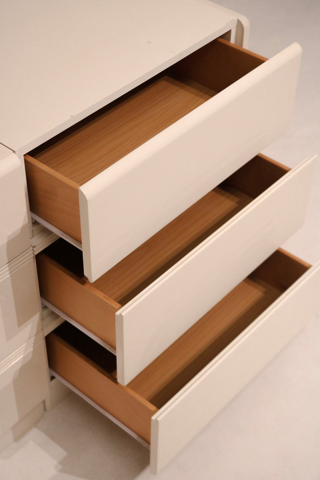 Interior view of top drawer showing depth and wood color quality