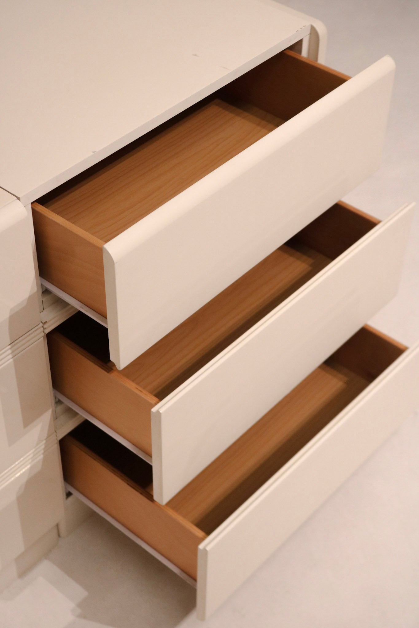 Interior view of top drawer showing depth and wood color quality