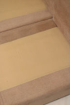 Close-up of fabric pattern and color variation on Mcm sectional sofa showing brown-dominant hue with subtle pink undertones in weave