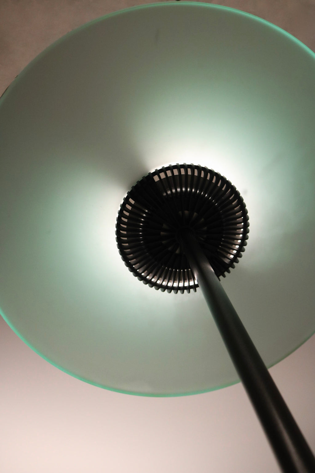 Rear view of floor lamp to show depth, curvature, and lighting structure
