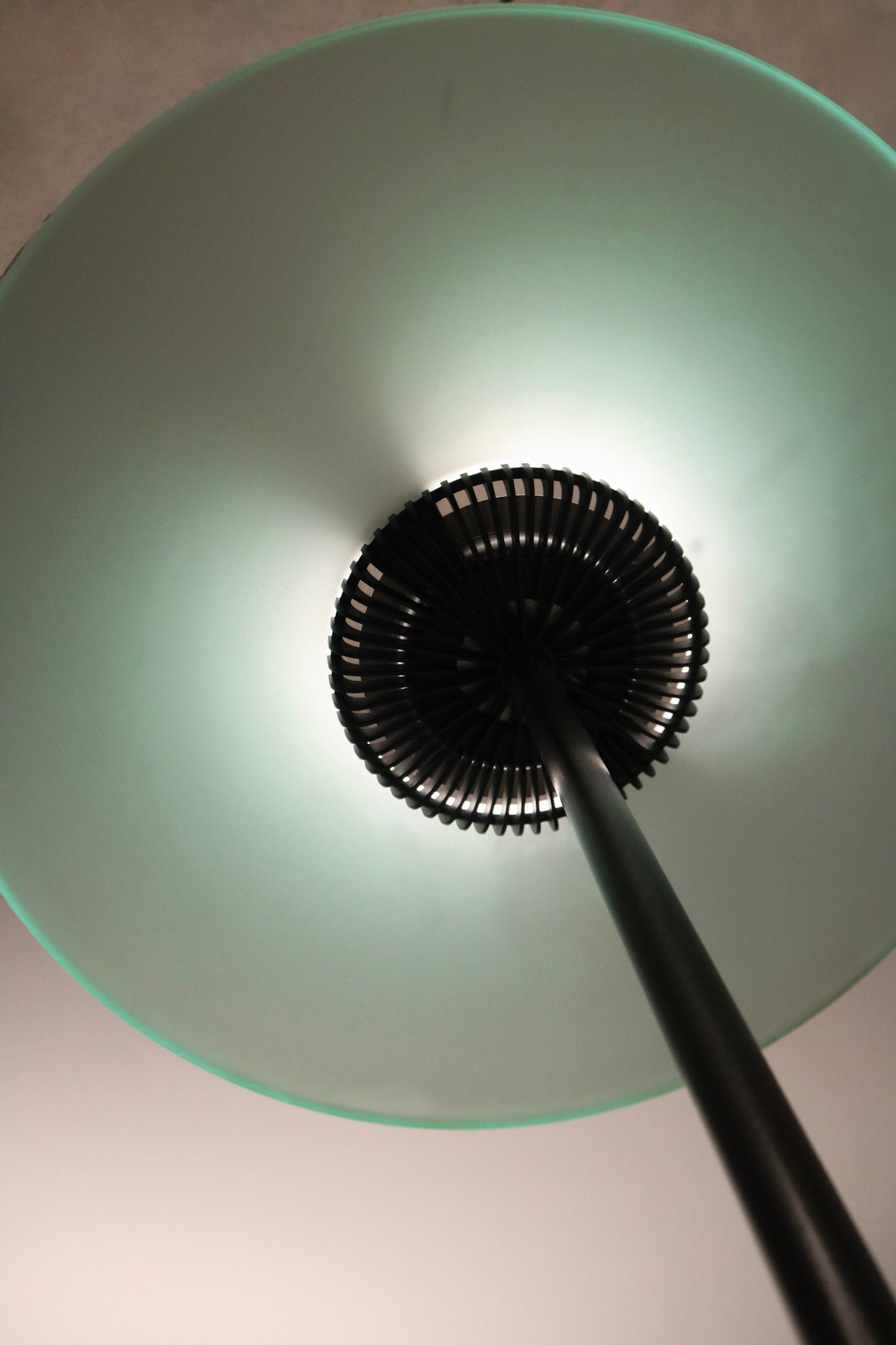Rear view of floor lamp to show depth, curvature, and lighting structure