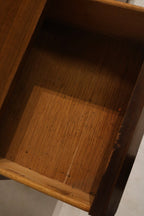 Mid-century profile detail focusing on clean horizontal lines, low silhouette and refined walnut finish