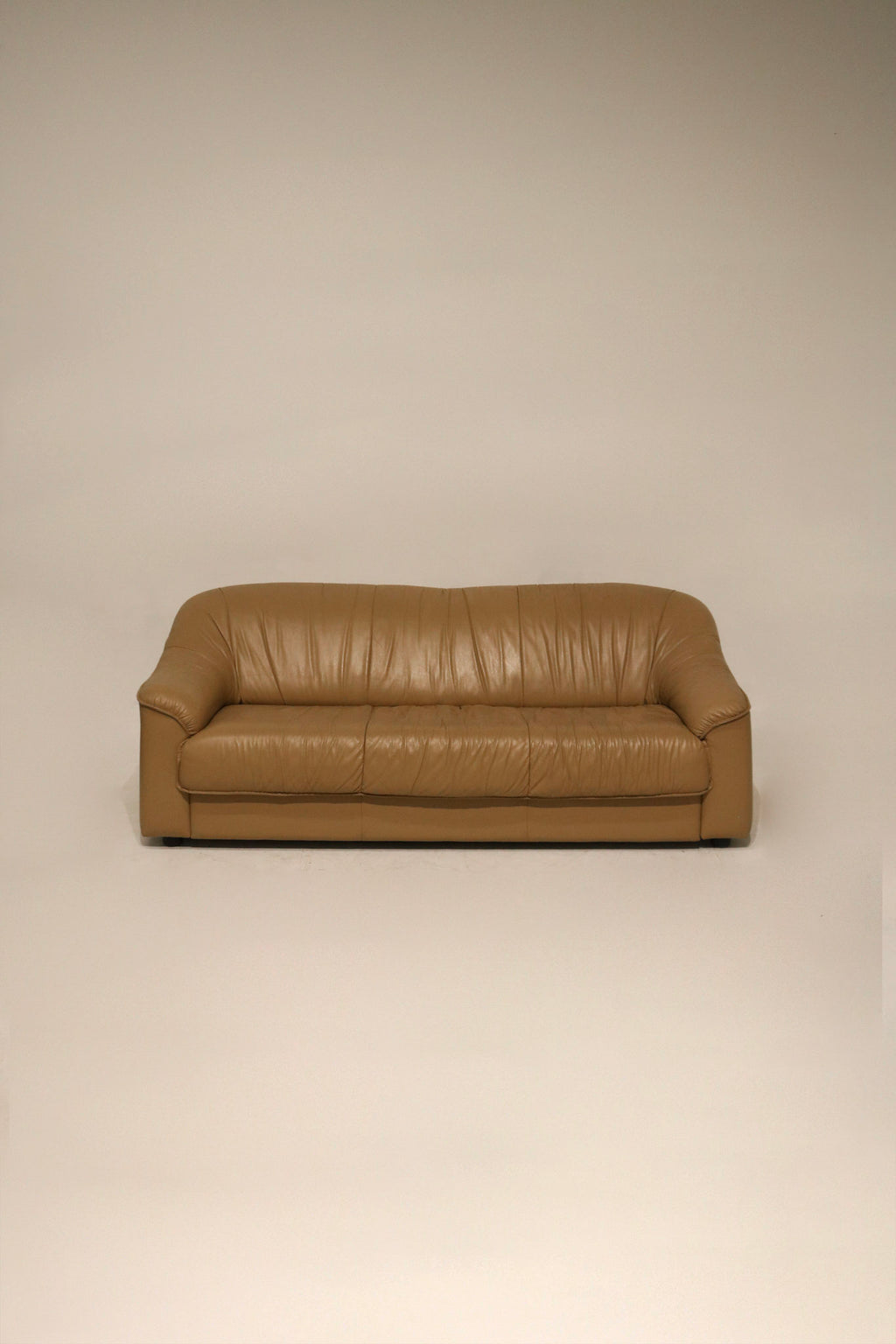 Full view of vintage Italian leather sofa couch in beige brown with clean lines