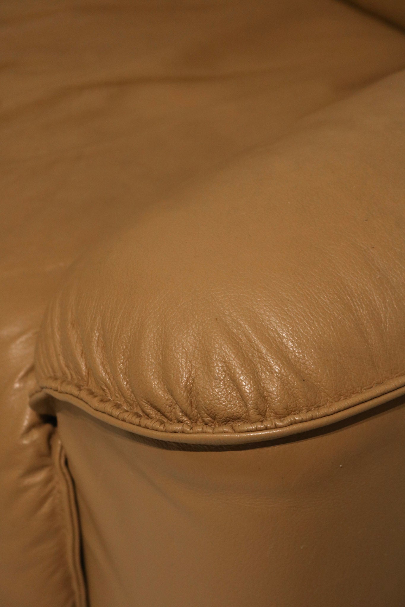Detail of seat cushion seam highlighting stitching and leather quality