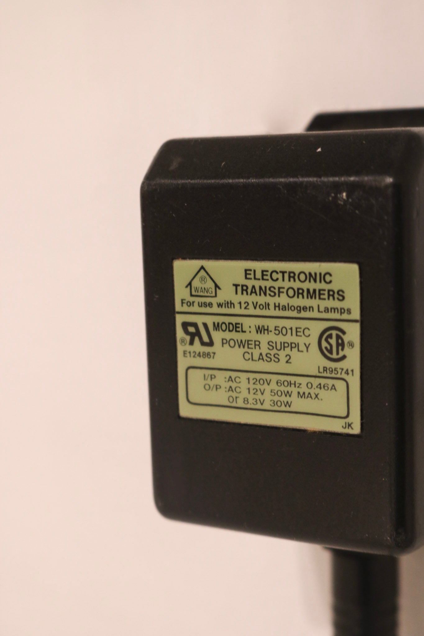 Detail of adjustable steel arm showcasing chrome joints and hardware construction