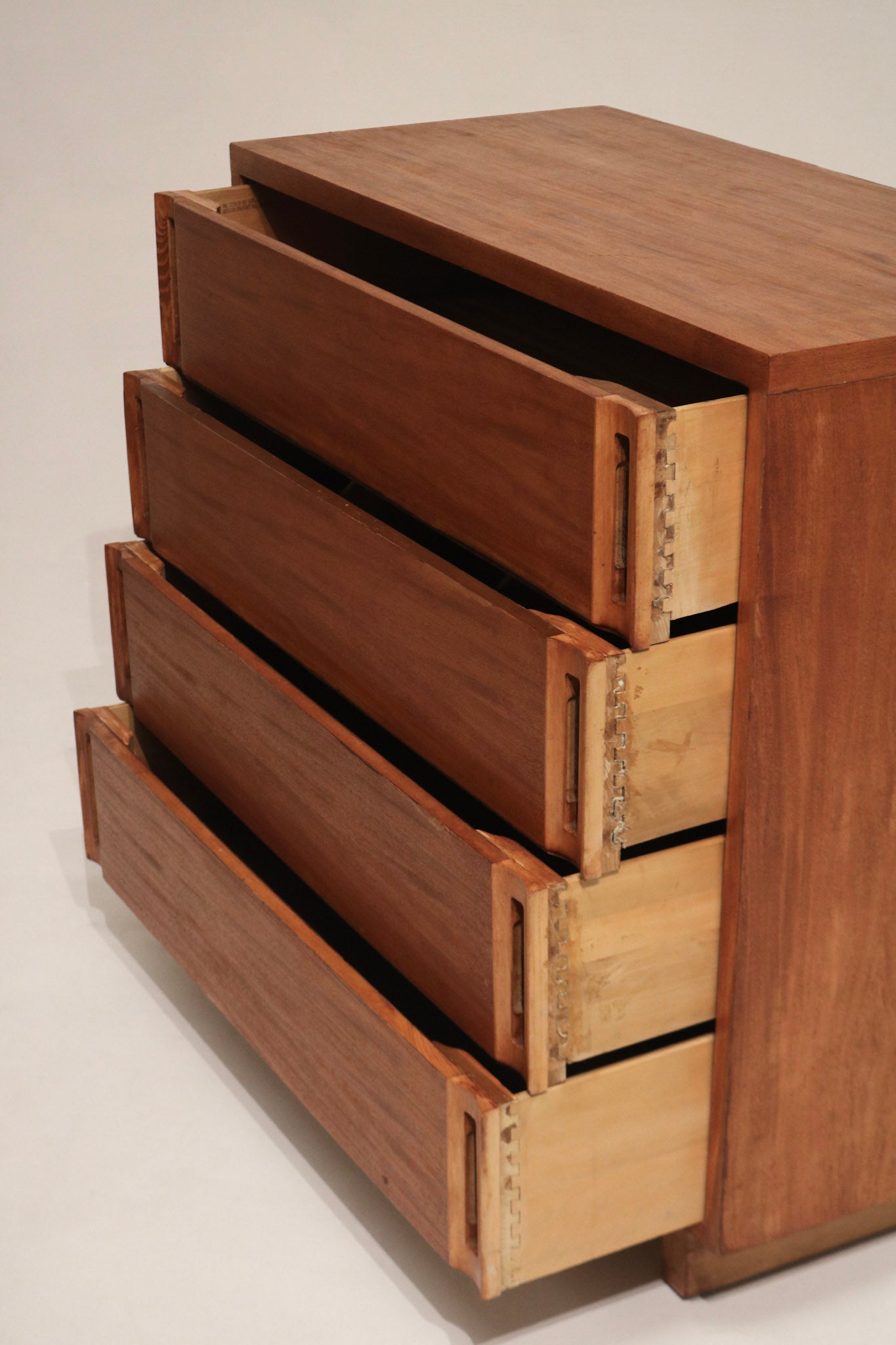 Photo focusing on drawer alignment and corner joints of vintage solid wood dresser, solid construction and reliable drawer fit shown