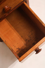 Perspective shot showing full depth and profile of vintage maple wood desk in NYC setting