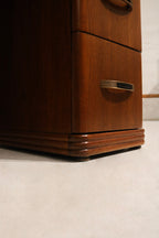 Detail: close-up of walnut wood leg and foot showing tapered profile, joinery marks and original finish wear