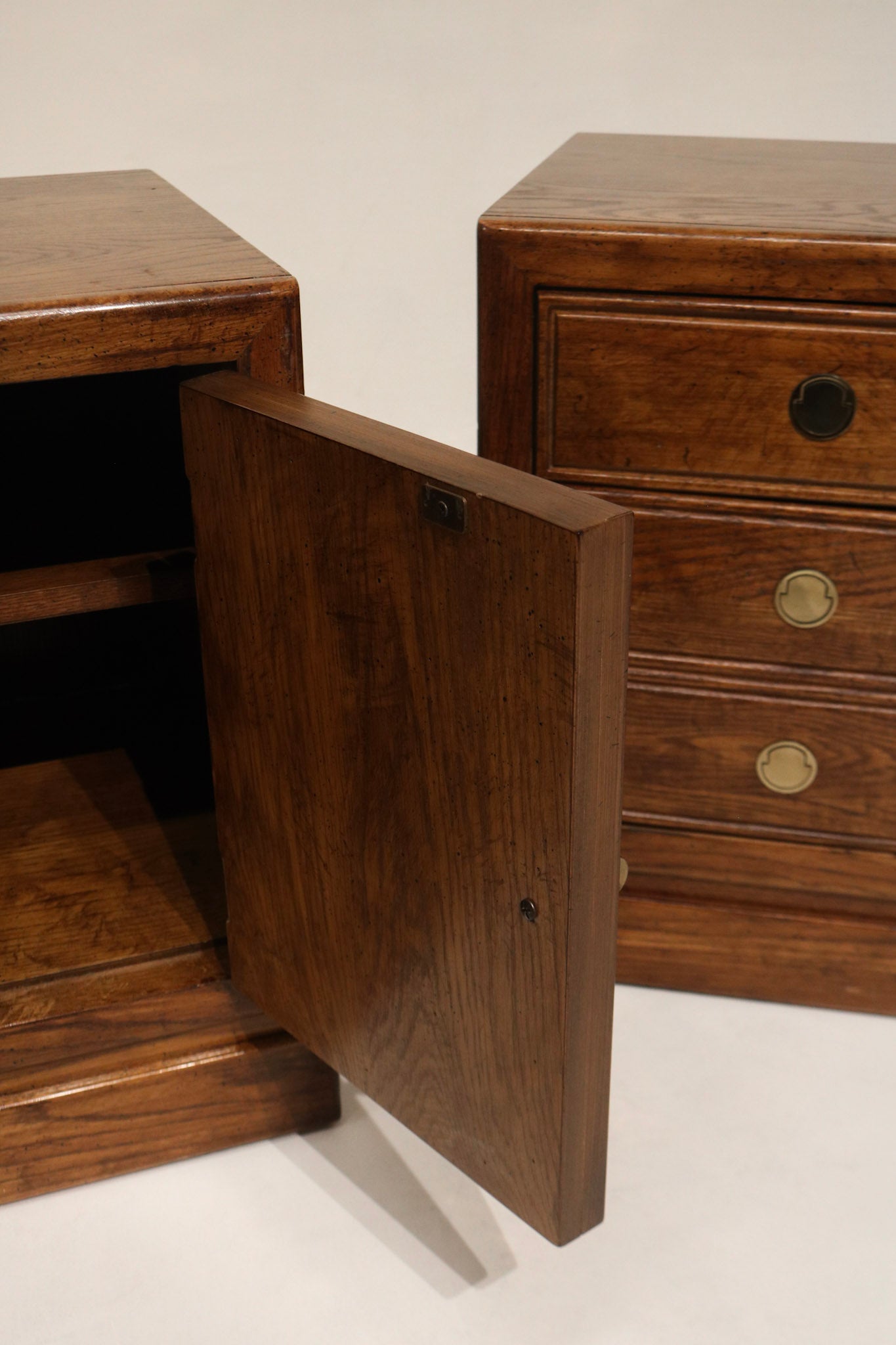 Side profile of the nightstand pair highlighting sturdy walnut legs, solid wood frame and veneer panels with substantial mid-century proportions. Perfect for NYC apartments.