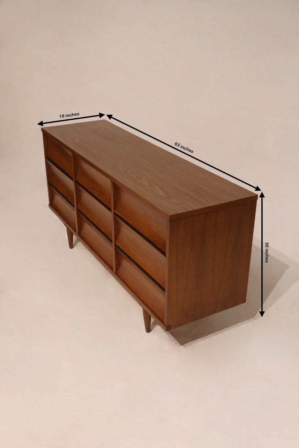 Dimensions of Johnson Carper walnut wood dresser: 63 inches long, 18 inches deep, 30 inches high