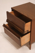 Interior view of open drawer showing clean wood lining and storage space