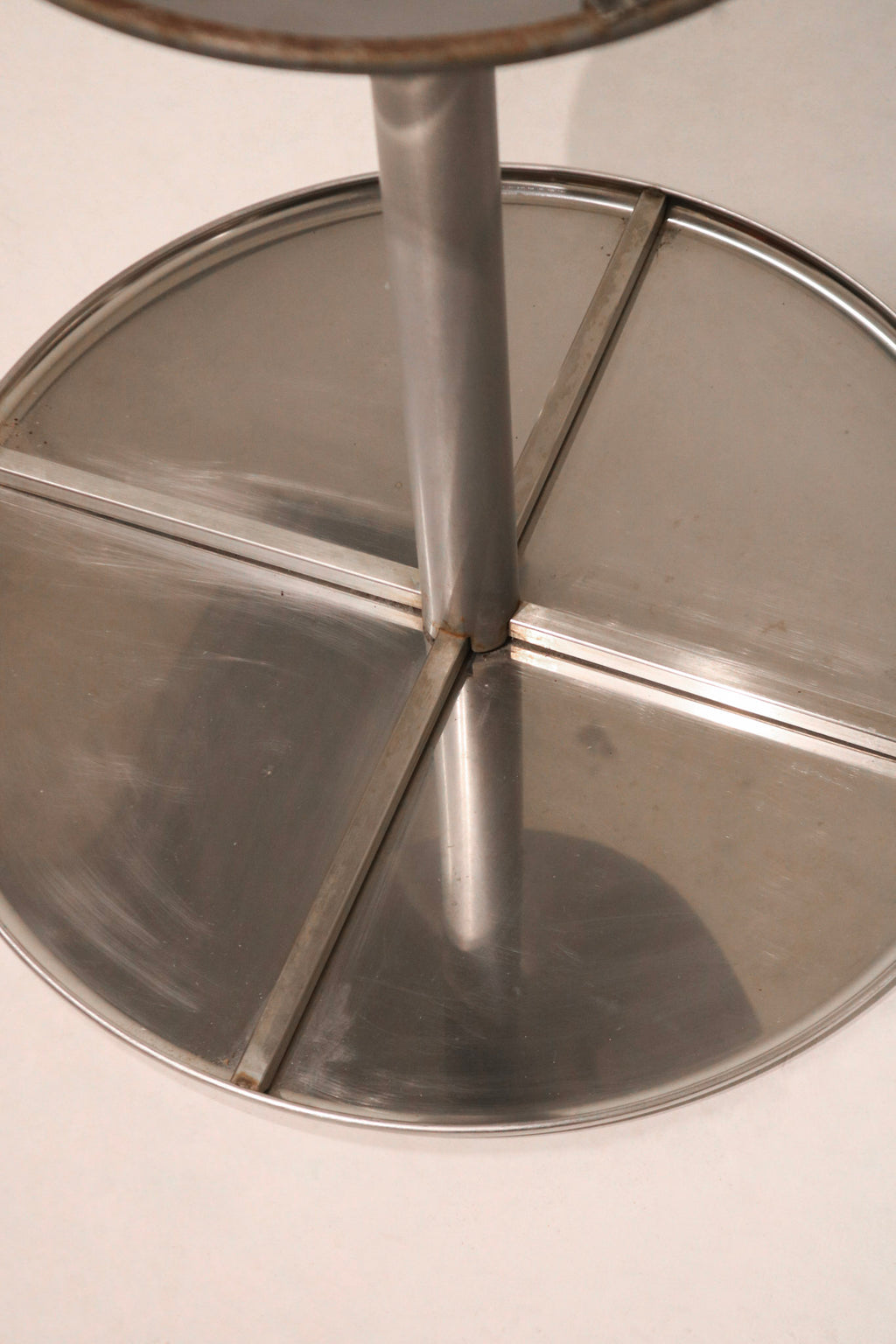 Detail of steel chromel tabletop with subtle brushed texture and industrial finish