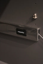 Top surface detail of lacquered wood texture with reflective finish on storage cabinet