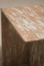 Polished tabletop reflection and marble grain close-up, showing pink tones, subtle veining and premium solid stone quality.