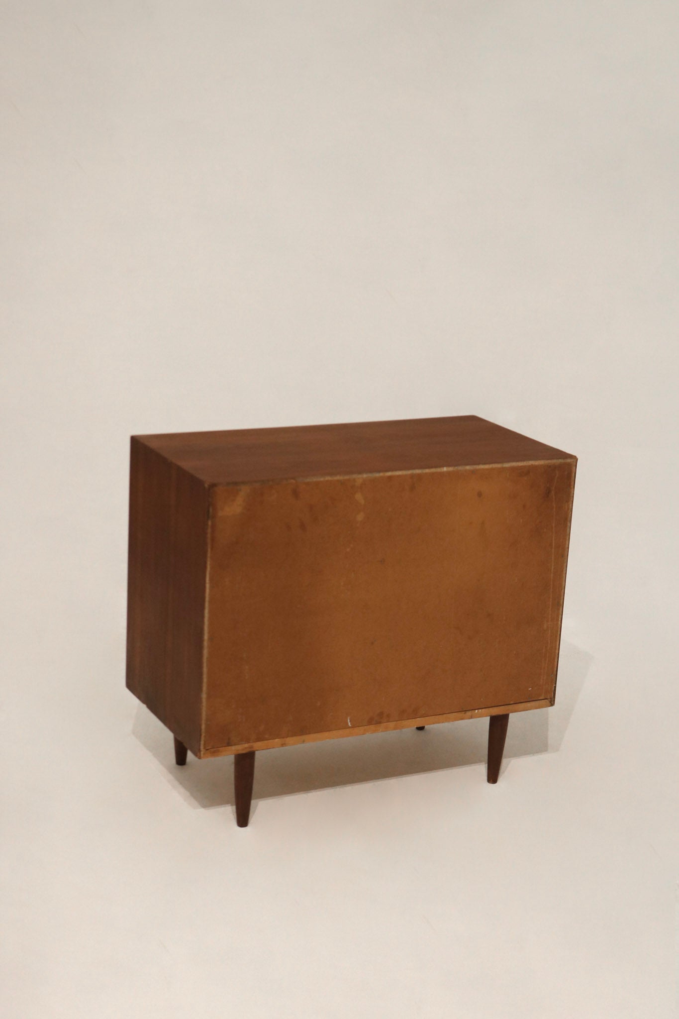 Close-up of walnut wood grain texture highlighting the dresser's natural vintage finish