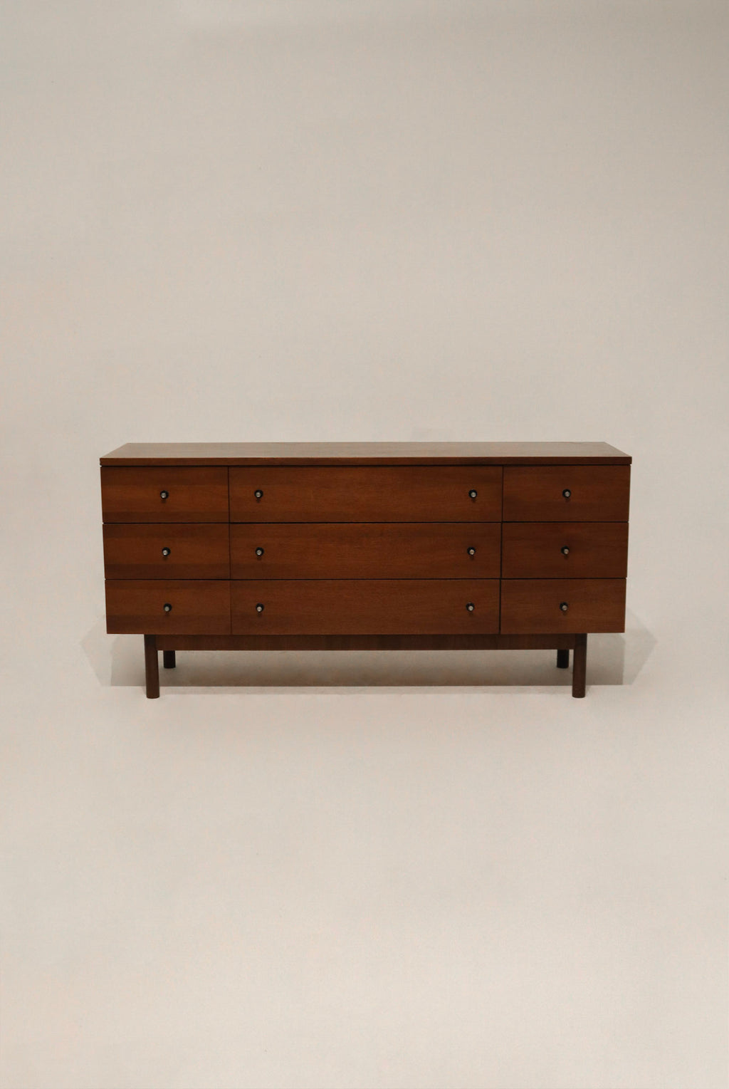 Main view of the Mid Century Modern walnut wood 9 drawers dresser by Stanley featuring solid wood construction and sleek design