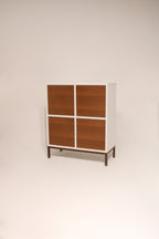 Front view of modern custom wood storage cabinet with doors and iron legs in NYC