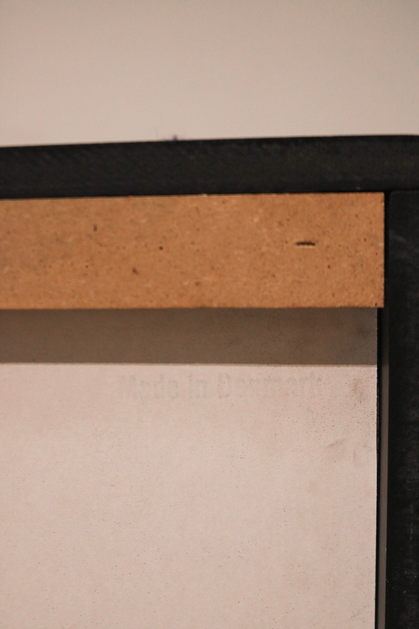 Close-up of solid pine wood texture and clean lines in Scandinavian small dresser