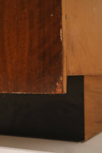 Underside and base view showing particle board base construction beneath solid walnut exterior and robust overall build