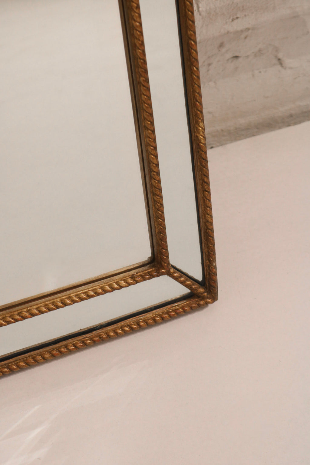Texture detail of solid wood golden frame, showing vintage patina and light wear