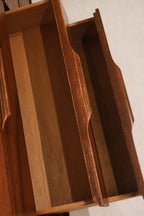 Interior view of a drawer revealing well-maintained clean wood and solid mounts