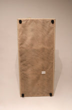 Detail of stitching and seam lines on beige Italian leather sofa, precision craftsmanship