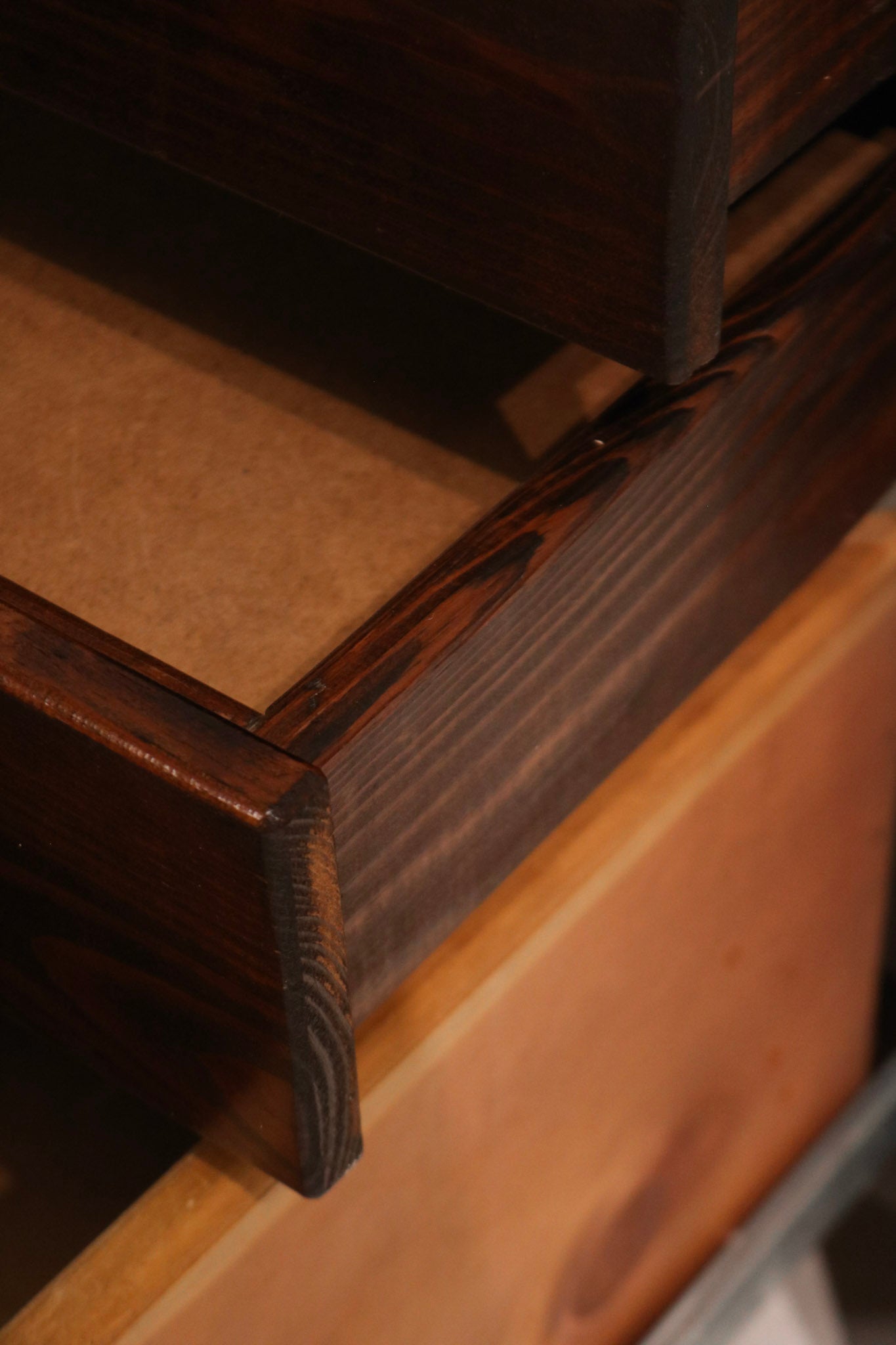 Zoom-in on the drawer tracks showing functional mechanics and hardware details