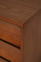 Vintage metal hardware on the walnut wood dresser highlighting mid-century modern design