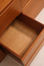 Detailed view of interior drawer finish and construction of vintage teak dresser
