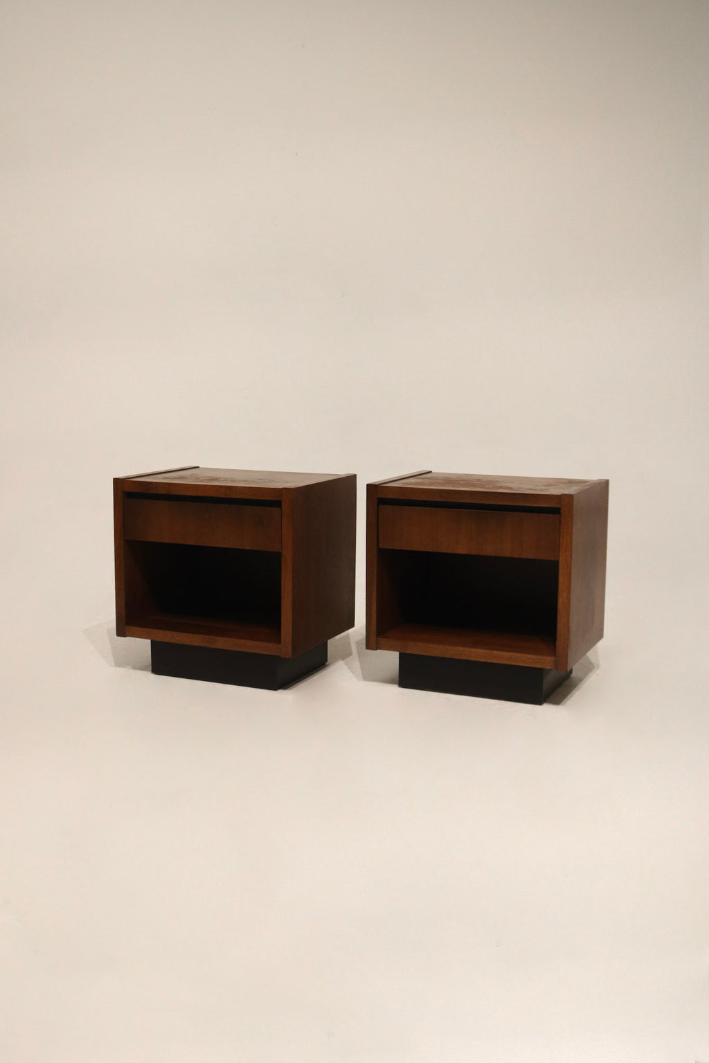 Main view: Pair of MCM walnut wood nightstands by Lane, full frontal shot showing walnut grain, tapered legs and mid-century silhouette